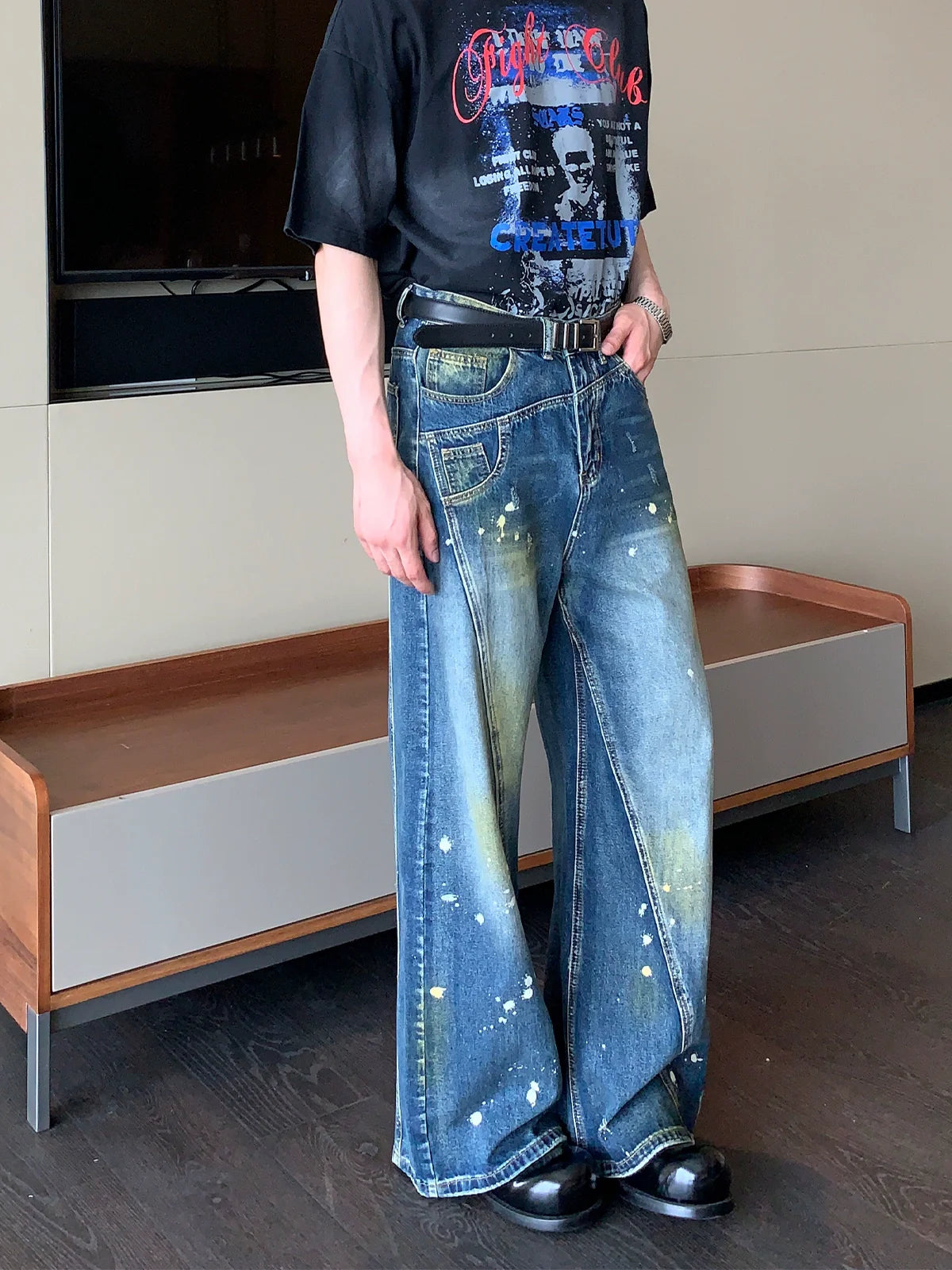 Wide-Leg Blue Jeans with Paint Splatter and Diagonal Seam Details